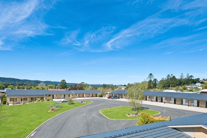 Wide view of the motel buildings with the Bega Valley hills behind